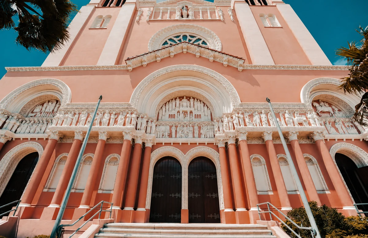The ornate pink facade and entrance of St. Anne of the Sunset Church in San Francisco